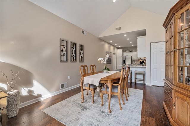 139 Canter Ln, West Deer, PA 15044 - dining area with dark wood-style flooring, baseboards, and high vaulted ceiling