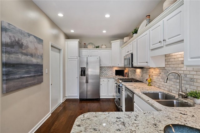 139 Canter Ln, West Deer, PA 15044 - kitchen featuring appliances with stainless steel finishes, a sink, white cabinets, light stone counters, and recessed lighting