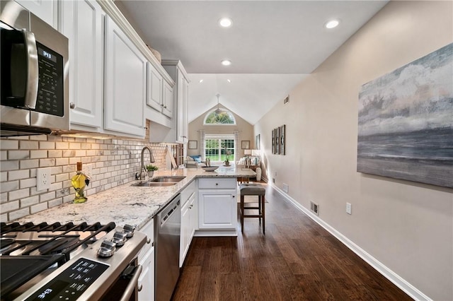 139 Canter Ln, West Deer, PA 15044 - kitchen featuring stainless steel appliances, a sink, a peninsula, dark wood finished floors, and white cabinets