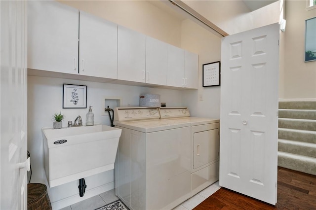139 Canter Ln, West Deer, PA 15044 - washroom featuring cabinet space, washer and dryer, and wood finished floors