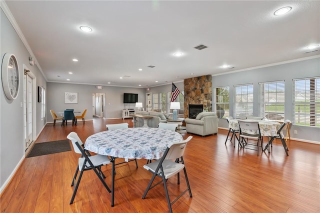 139 Canter Ln, West Deer, PA 15044 - dining area featuring crown molding, recessed lighting, baseboards, a fireplace, and light wood-style floors