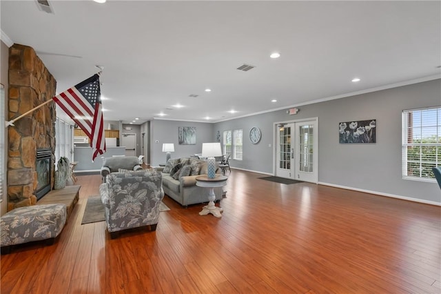 139 Canter Ln, West Deer, PA 15044 - living area with crown molding, wood finished floors, baseboards, a fireplace, and french doors