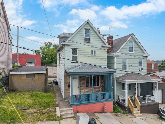 224 Moye Pl, Mount Oliver, PA 15210 - view of front of property with a porch, roof with shingles, and a chimney