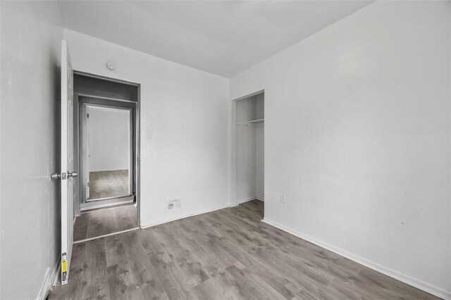 224 Moye Pl, Mount Oliver, PA 15210 - unfurnished bedroom featuring wood finished floors, a closet, and baseboards
