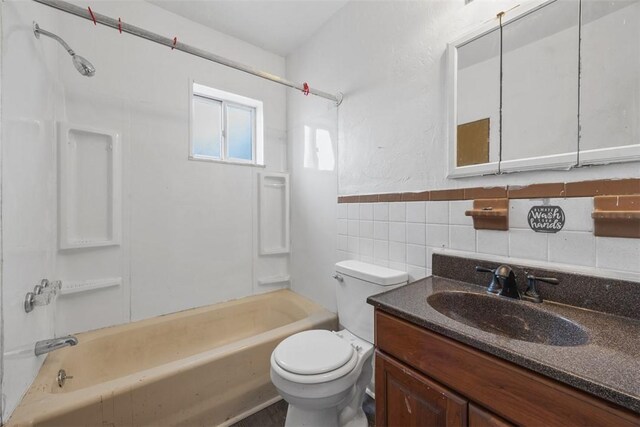 224 Moye Pl, Mount Oliver, PA 15210 - full bath with bathtub / shower combination, toilet, vanity, tile walls, and a wainscoted wall