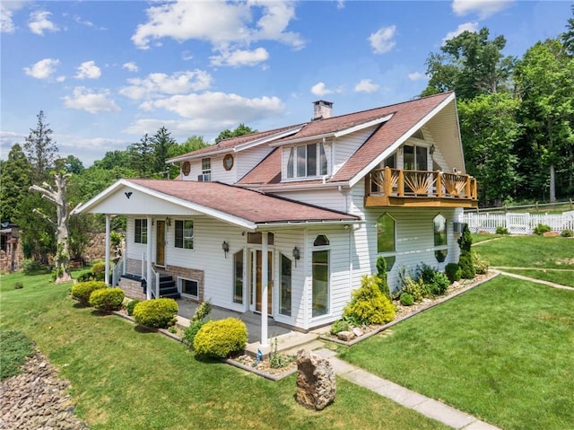 1303 Isabella Rd, Connellsville, PA 15425 - rear view of house with a chimney, a balcony, and roof with shingles