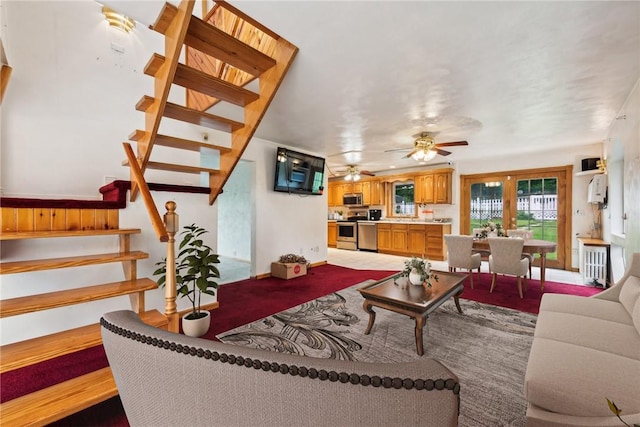 1303 Isabella Rd, Connellsville, PA 15425 - living area with stairs, ceiling fan, and baseboards