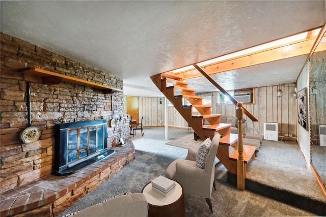 1303 Isabella Rd, Connellsville, PA 15425 - carpeted living room featuring stairs and wooden walls
