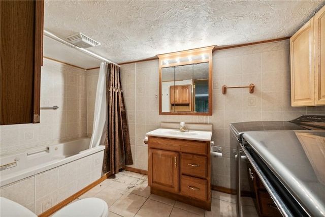 1303 Isabella Rd, Connellsville, PA 15425 - bathroom featuring vanity, tiled shower / bath, toilet, tile patterned flooring, and tile walls