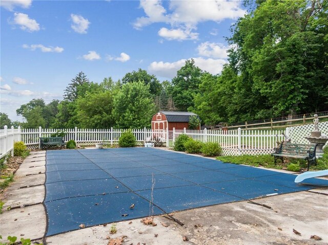 1303 Isabella Rd, Connellsville, PA 15425 - view of swimming pool featuring a water slide, a fenced backyard, and a patio area