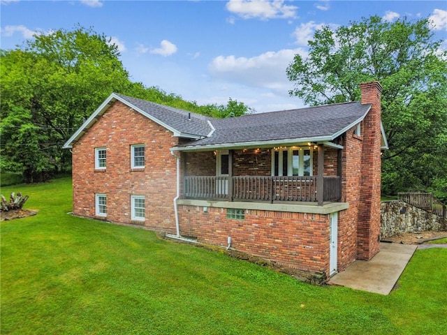 452 Cadogan Slate Lick Rd, North Buffalo Twp, PA 16201 - view of front facade with a front lawn, a chimney, brick siding, and roof with shingles