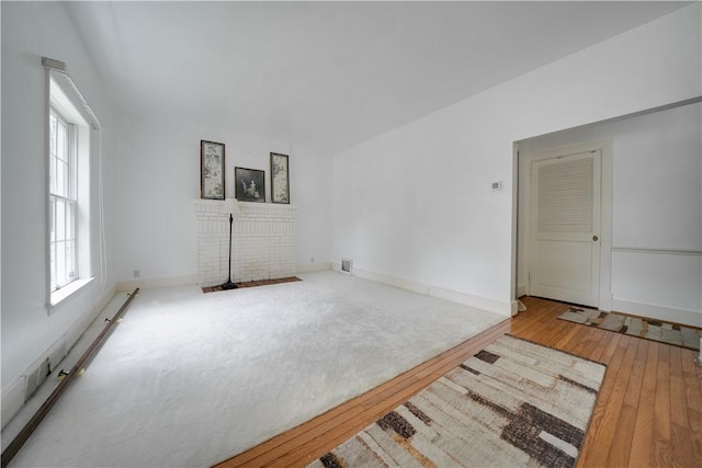 115 Orchard Ave, Rostraver, PA 15012 - unfurnished living room featuring hardwood / wood-style flooring and baseboards