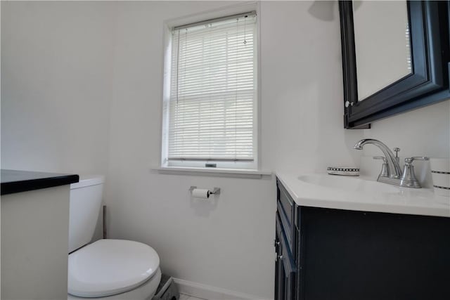 115 Orchard Ave, Rostraver, PA 15012 - half bath featuring toilet, vanity, and baseboards