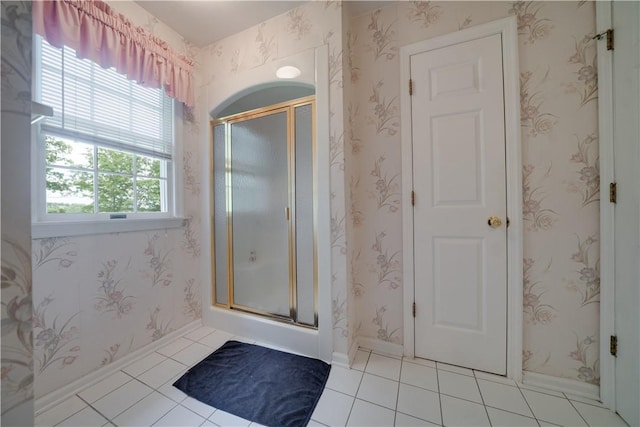 115 Orchard Ave, Rostraver, PA 15012 - bathroom featuring a stall shower, tile patterned floors, and baseboards