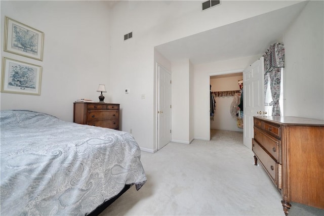 115 Orchard Ave, Rostraver, PA 15012 - bedroom featuring light colored carpet, a spacious closet, a towering ceiling, a closet, and baseboards