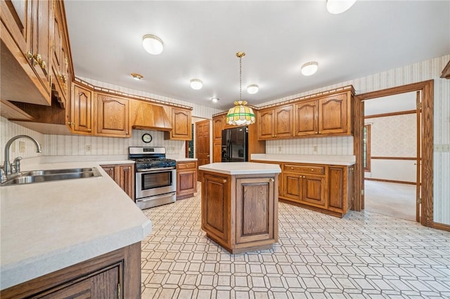 1001 Grand Ave, Hopewell Twp Bea, PA 15001 - kitchen with stainless steel range with gas cooktop, a sink, black fridge, wallpapered walls, and light countertops