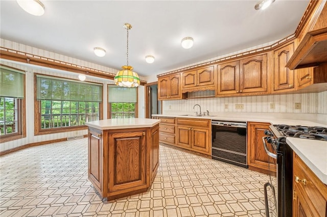 1001 Grand Ave, Hopewell Twp Bea, PA 15001 - kitchen with dishwasher, stainless steel gas range, brown cabinetry, a sink, and light countertops