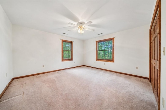 1001 Grand Ave, Hopewell Twp Bea, PA 15001 - spare room featuring light carpet, a ceiling fan, and baseboards
