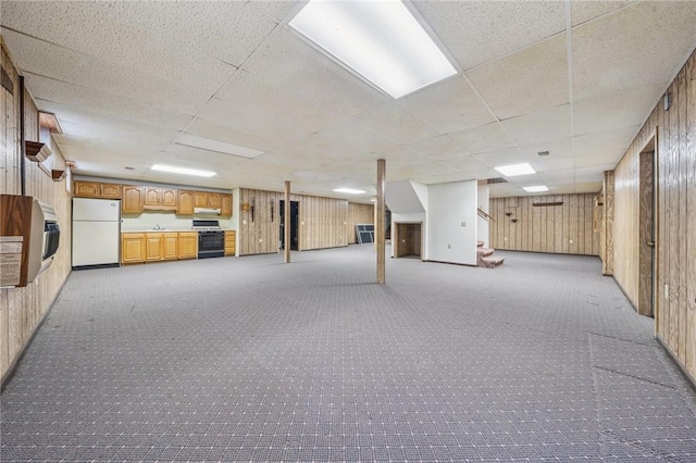 1001 Grand Ave, Hopewell Twp Bea, PA 15001 - finished below grade area with freestanding refrigerator, a paneled ceiling, light carpet, wooden walls, and a sink
