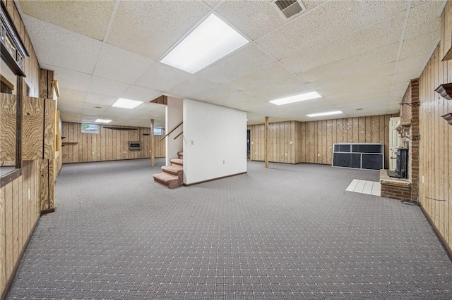 1001 Grand Ave, Hopewell Twp Bea, PA 15001 - finished below grade area featuring wood walls, stairway, a drop ceiling, carpet flooring, and a fireplace
