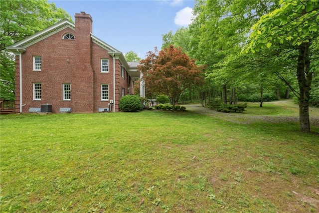 1001 Grand Ave, Hopewell Twp Bea, PA 15001 - view of side of property featuring a chimney, brick siding, and a lawn