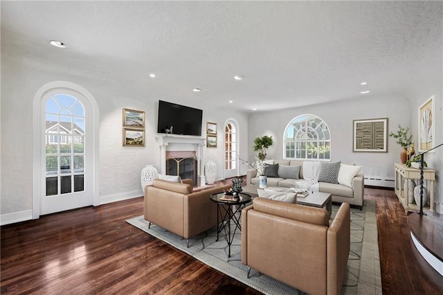 6820 Edgerton, Point Breeze, PA 15208 - living area with baseboard heating, healthy amount of natural light, wood finished floors, recessed lighting, and baseboards