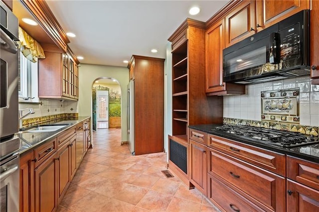 6820 Edgerton, Point Breeze, PA 15208 - kitchen with black appliances, arched walkways, a sink, backsplash, and recessed lighting