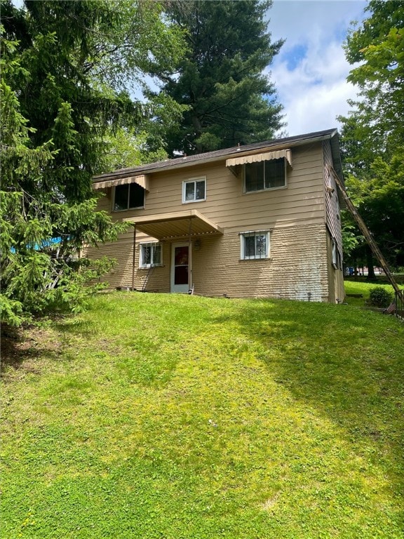 7740 Pershing St, Penn Hills, PA 15235 - back of property with a yard and brick siding