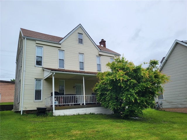 1003-1007 Youngstown Ridge Rd, Unity Twp, PA 15696 - view of front of property featuring a chimney, a porch, and a front lawn