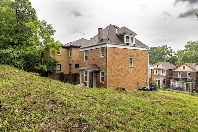 1044 Flemington St, Greenfield, PA 15217 - back of property featuring a chimney and brick siding