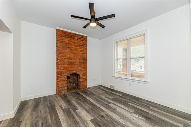 1044 Flemington St, Greenfield, PA 15217 - unfurnished living room with ceiling fan, wood finished floors, a brick fireplace, and baseboards