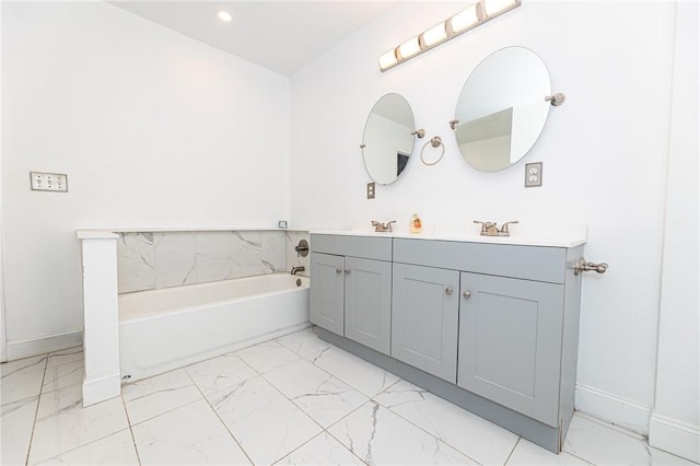 1044 Flemington St, Greenfield, PA 15217 - bathroom with marble finish floors, a bath, double vanity, and baseboards