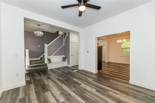 1044 Flemington St, Greenfield, PA 15217 - unfurnished living room with a chandelier, wood finished floors, stairs, and baseboards