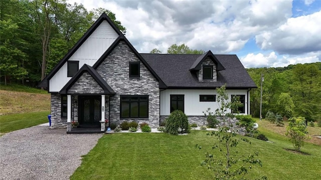 267 Reibold Rd, Forward Twp But, PA 16053 - view of front of house featuring stone siding and a front lawn