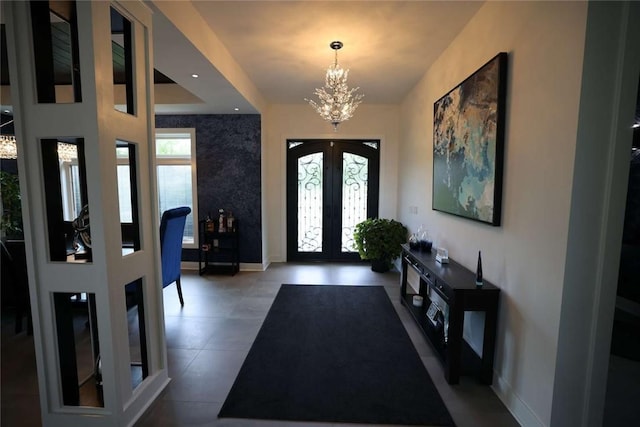 267 Reibold Rd, Forward Twp But, PA 16053 - tiled foyer entrance with french doors, healthy amount of natural light, and a chandelier
