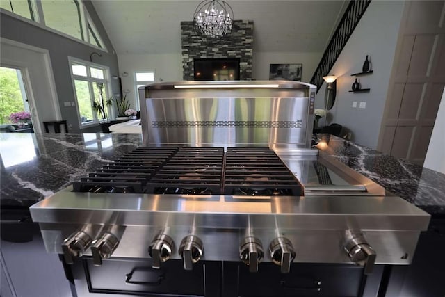 267 Reibold Rd, Forward Twp But, PA 16053 - kitchen view of a chandelier, range, and dark stone countertops