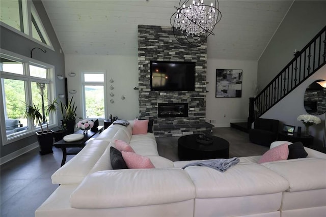 267 Reibold Rd, Forward Twp But, PA 16053 - living area with vaulted ceiling, baseboards, a chandelier, stairs, and a fireplace