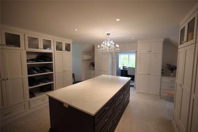267 Reibold Rd, Forward Twp But, PA 16053 - kitchen with white cabinets, a kitchen island, a chandelier, glass insert cabinets, and recessed lighting