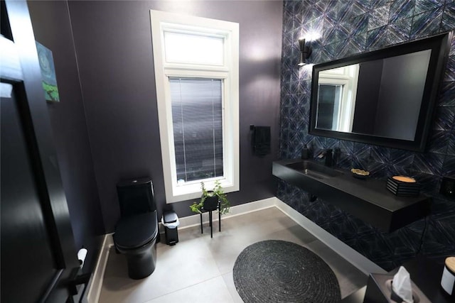 267 Reibold Rd, Forward Twp But, PA 16053 - bathroom with toilet, a sink, and baseboards