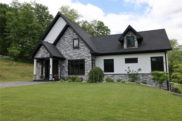 267 Reibold Rd, Forward Twp But, PA 16053 - view of front of property with stone siding, a front lawn, and board and batten siding