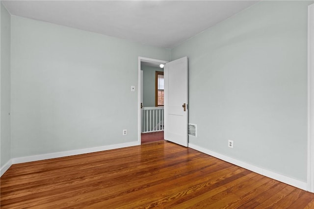 907 Greenfield Ave, Greenfield, PA 15217 - empty room with wood finished floors and baseboards