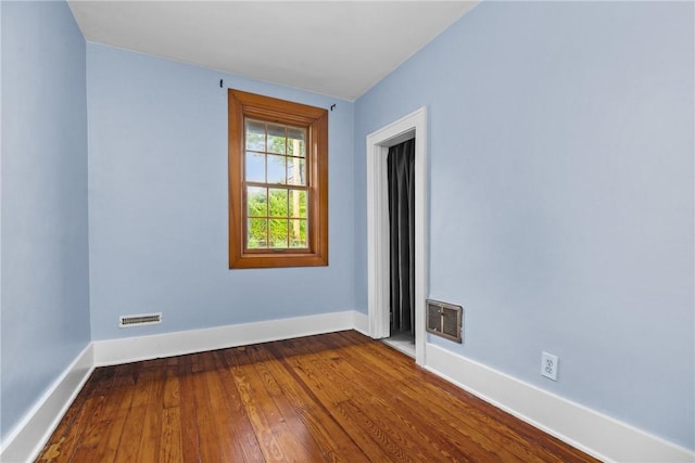 907 Greenfield Ave, Greenfield, PA 15217 - spare room featuring baseboards and dark wood-style flooring