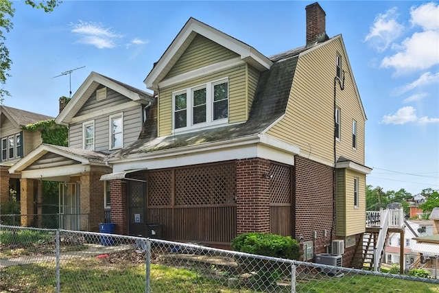 332 Reifert St, Knoxville, PA 15210 - view of front of house with brick siding, a chimney, and roof with shingles