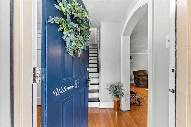 55 Evergreen Ter, Uniontown, PA 15401 - entryway featuring wood finished floors, arched walkways, and baseboards