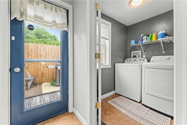 55 Evergreen Ter, Uniontown, PA 15401 - laundry room featuring separate washer and dryer, healthy amount of natural light, tile patterned floors, and baseboards