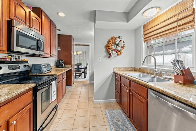 55 Evergreen Ter, Uniontown, PA 15401 - kitchen featuring stainless steel appliances, a sink, light tile patterned floors, baseboards, and a chandelier