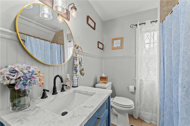 55 Evergreen Ter, Uniontown, PA 15401 - bathroom featuring vanity, toilet, tile patterned flooring, wainscoting, and a shower with shower curtain