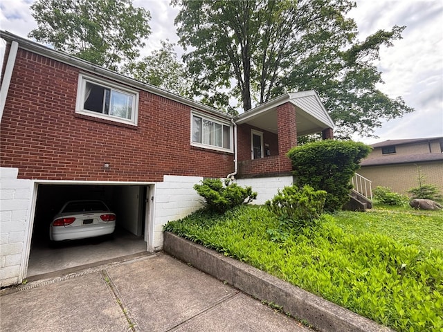 1132 Onondago St, Squirrel Hill, PA 15218 - view of front of property with brick siding, driveway, and an attached garage