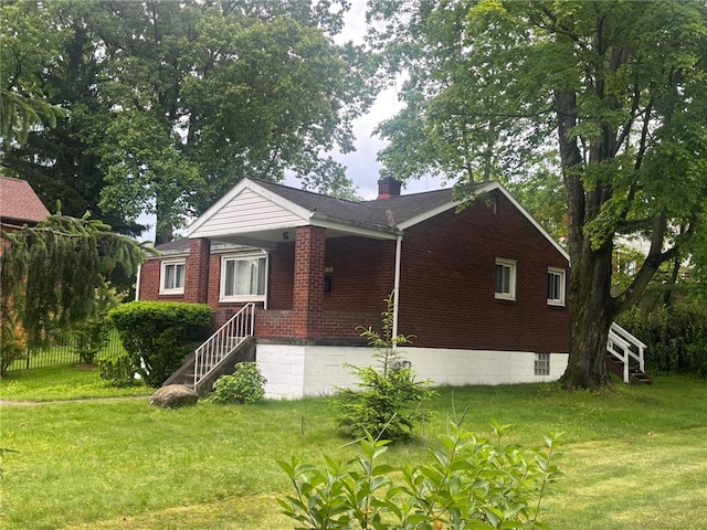 1132 Onondago St, Squirrel Hill, PA 15218 - view of front of home featuring stairs, brick siding, a front lawn, and a chimney