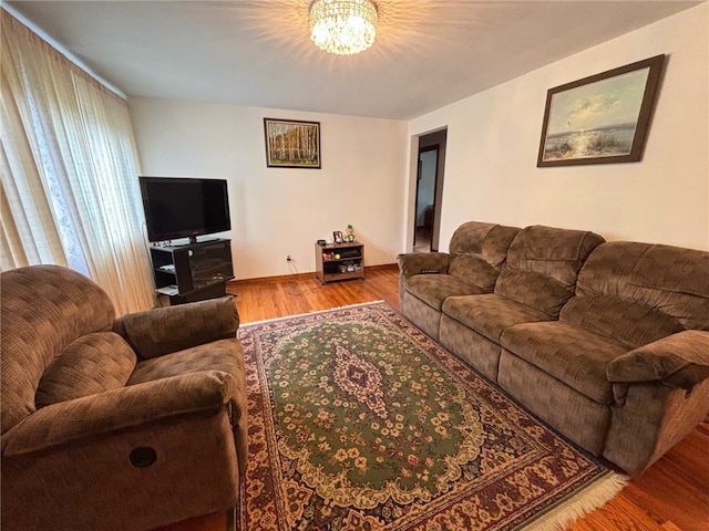 1132 Onondago St, Squirrel Hill, PA 15218 - living area with a chandelier and wood finished floors